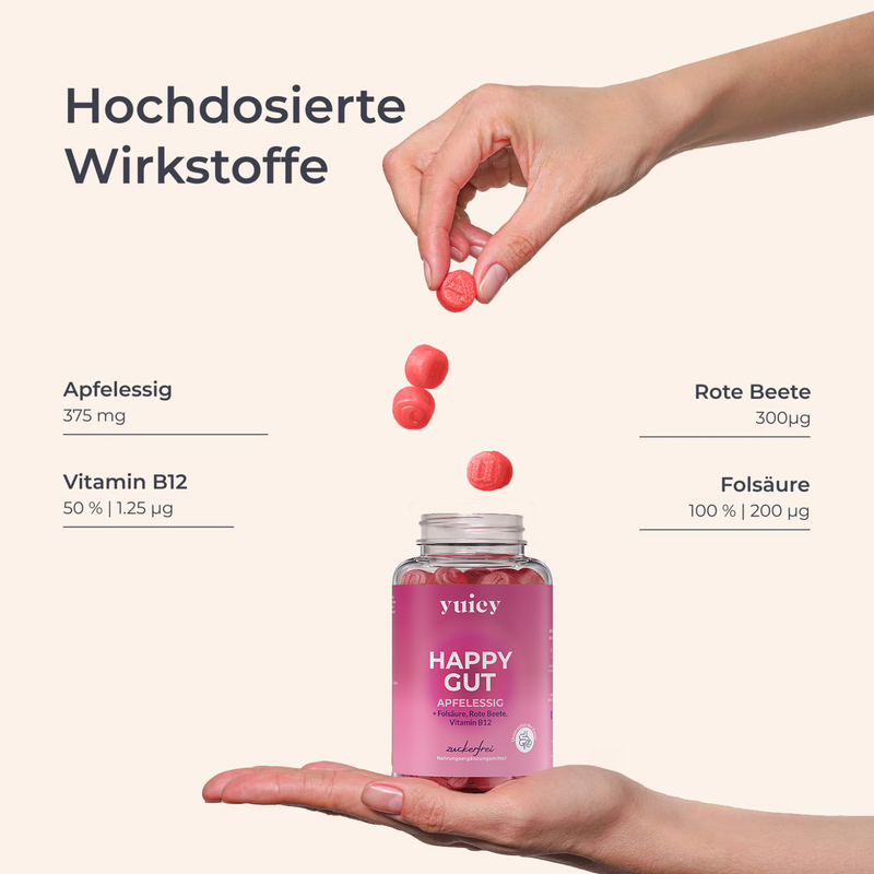 yuicy® Happy Gut Apfelessig Gummies mit hochdosierten Inhaltsstoffen: 375 mg Apfelessig, 300 µg Rote Beete, 200 µg Folsäure, 1,25 µg Vitamin B12 – Hand lässt Gummies in geöffnete Dose fallen